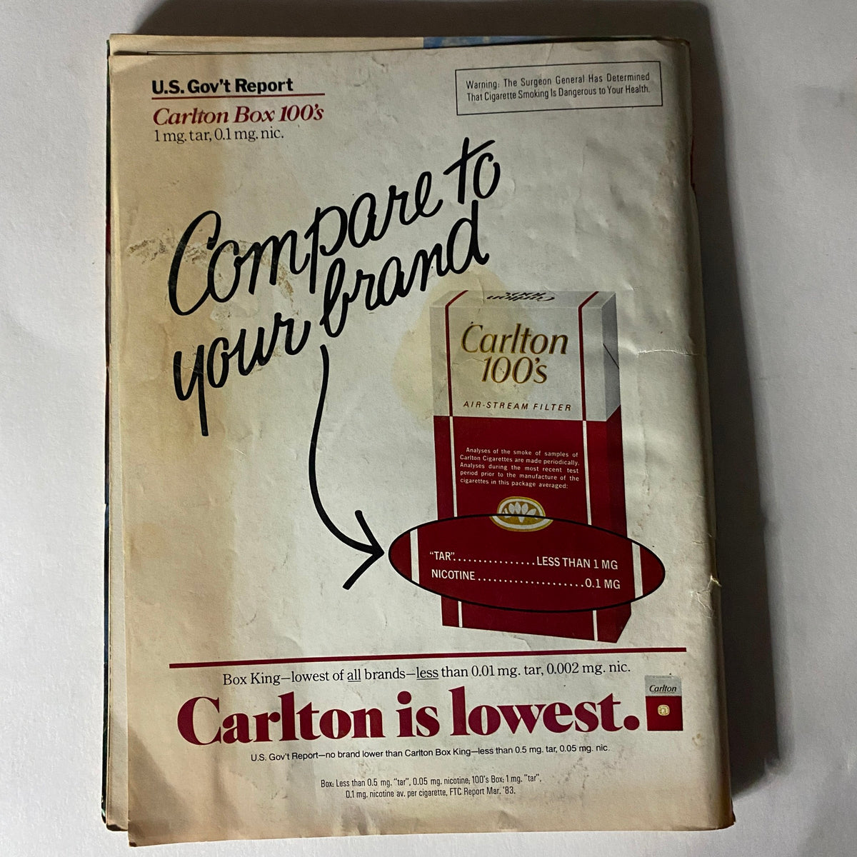 Back cover of the VTG Ebony Magazine May 1984 displaying an advertisement for Carlton 100's cigarettes with a comparison chart highlighting their low tar and nicotine content, in a vintage layout.