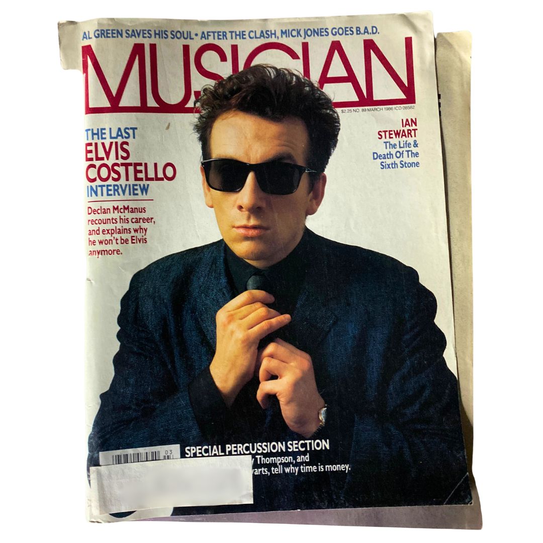 Cover of Musician Magazine March 1986, No. 89 featuring 'The Last Elvis Costello Interview' with a man in sunglasses and a black suit.