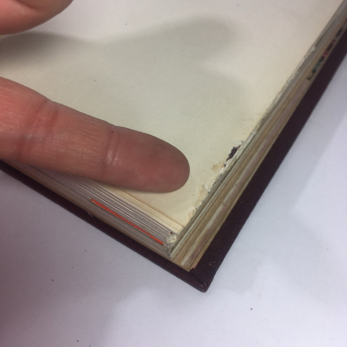 1937-1938 Woman's Day Magazine Compilation featuring a close-up of the page edges with visible wear, showcasing the book's vintage condition.