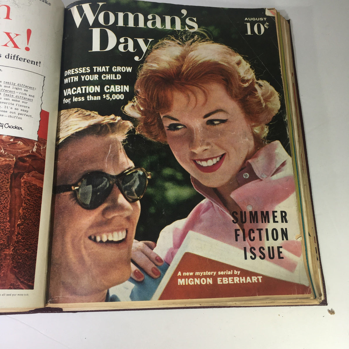 Cover of the August 1959 Woman's Day Magazine featuring a smiling woman and man, with themes on child-rearing and summer fiction.
