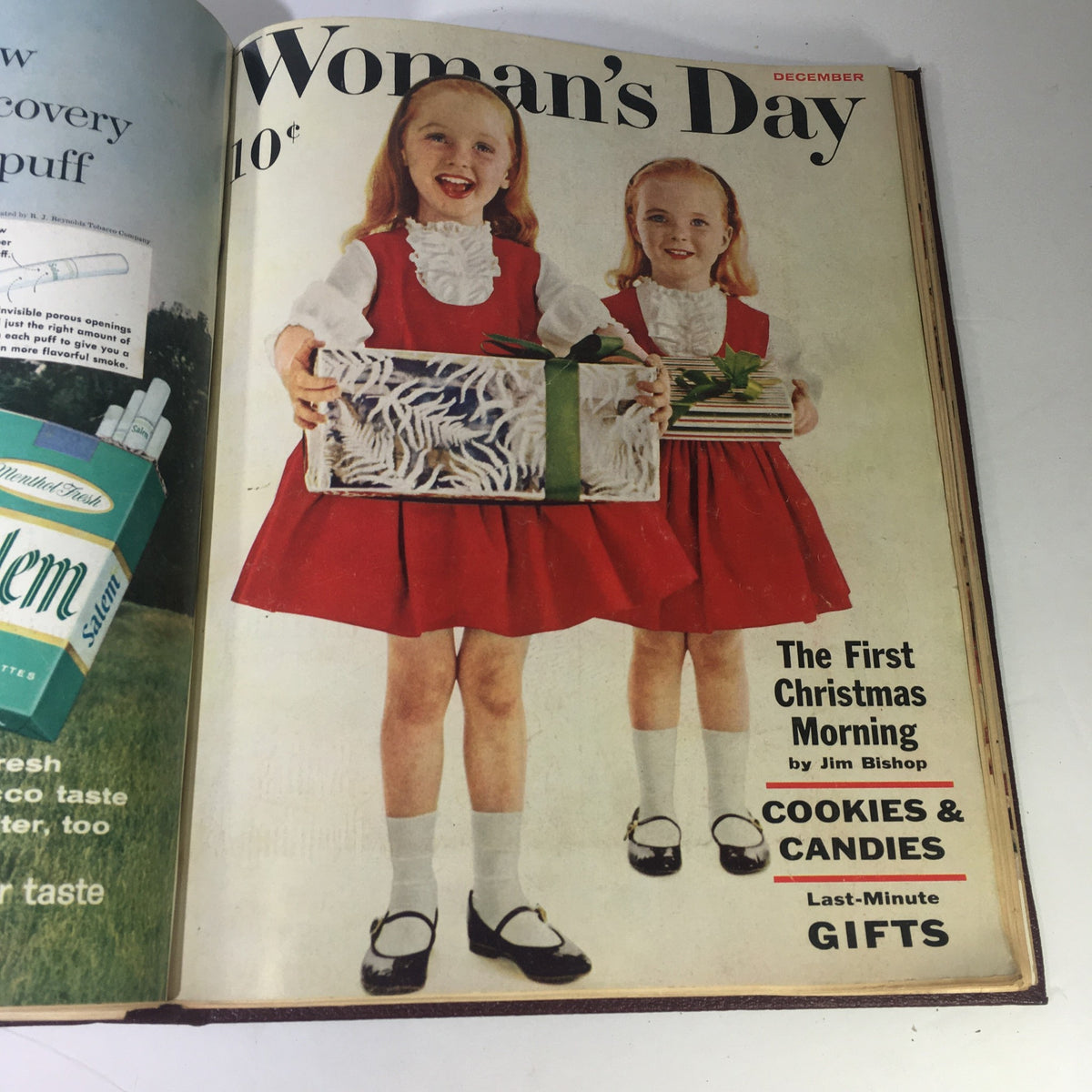 Cover image of the 1959 Woman's Day Magazine December issue featuring two girls in matching red dresses, holding presents, representing holiday themes.
