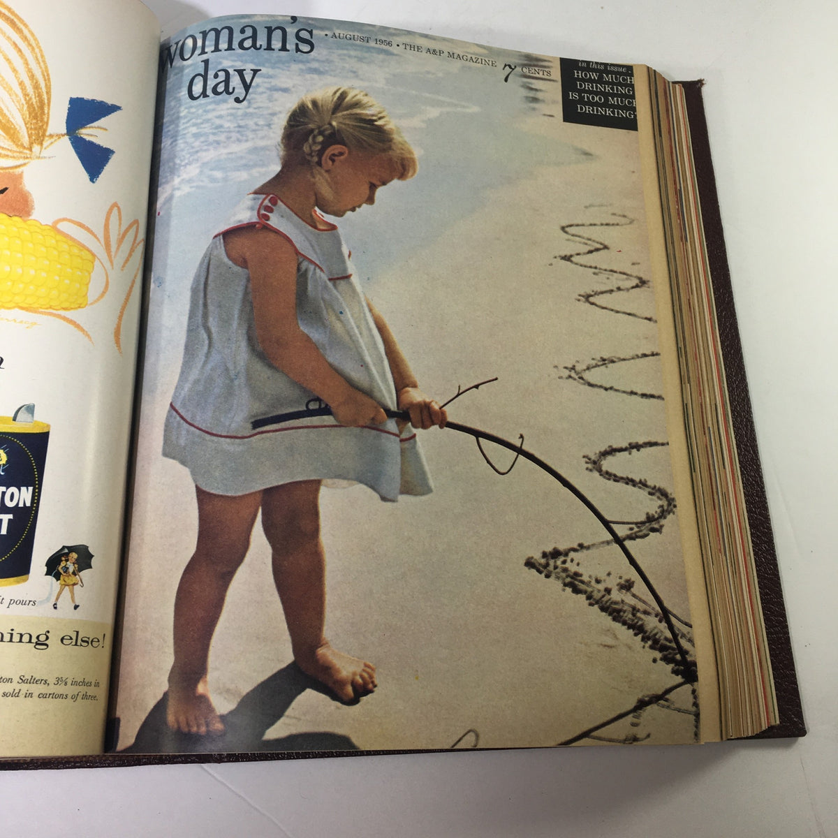 August 1956 Woman's Day Magazine cover depicting a young girl playing on the beach, part of the complete year round compilation.