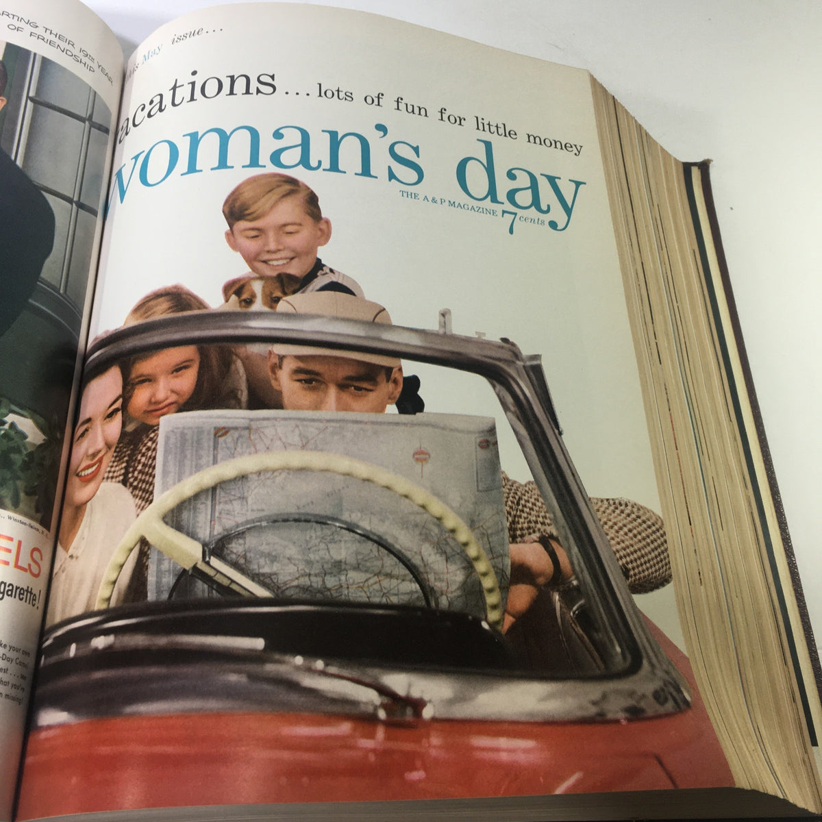 May issue of the 1954 Woman's Day Magazine featuring a family embarking on a budget-friendly vacation.