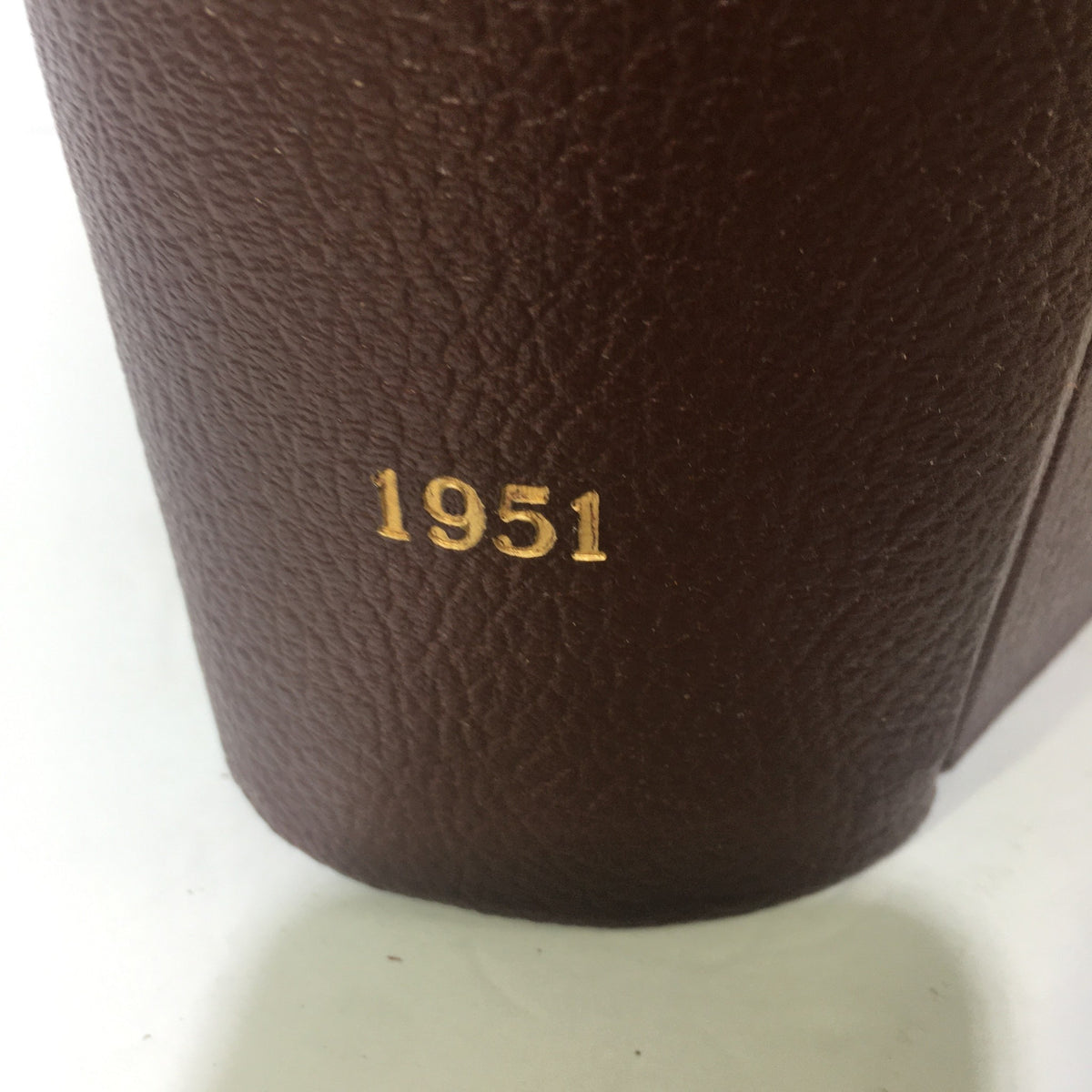Close-up view of the spine of the 1951 Woman's Day Magazine Compilation, highlighting the year '1951' in gold lettering.