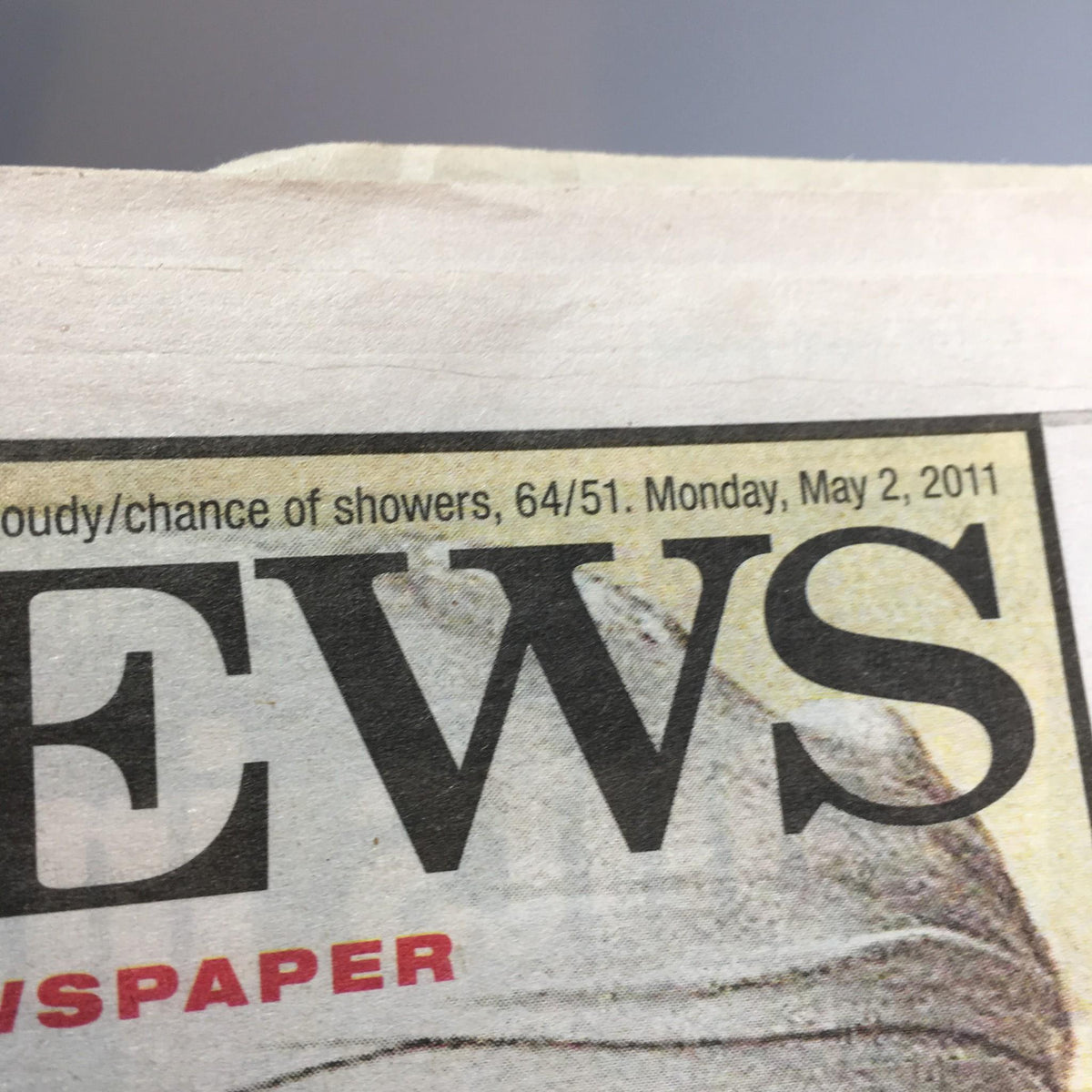 Top corner of the NY Daily News dated May 2, 2011, showing weather forecast, featuring a headline 'NEWS' related to Osama Bin Laden's death.