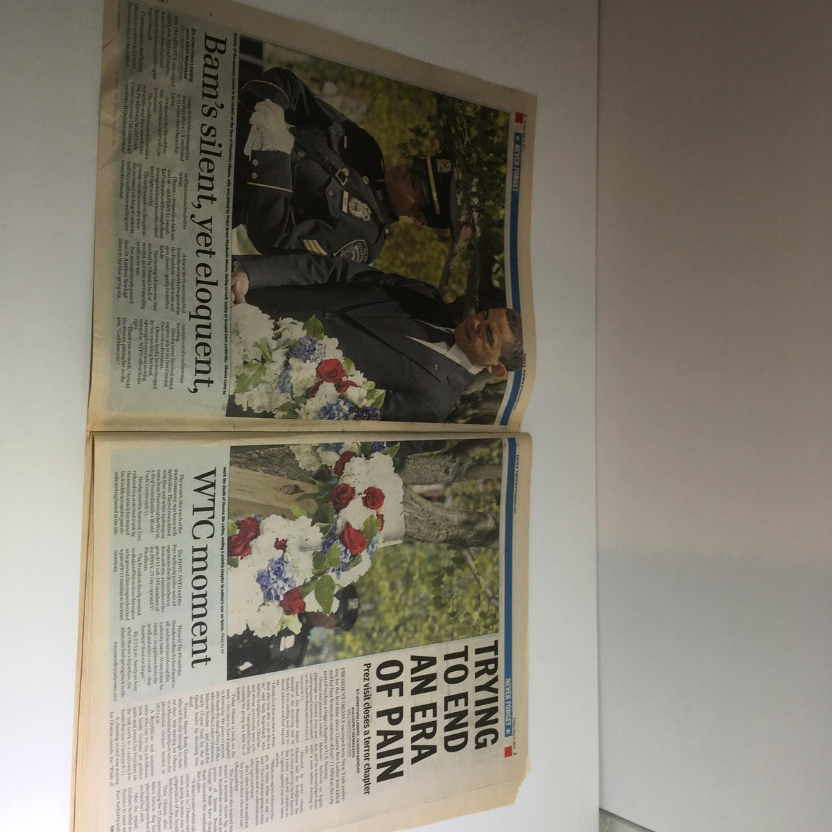Inside spread of NY Daily News reporting on Obama's visit to Ground Zero on May 6, 2011, with the headline 'WTC moment' and details on the emotional significance of the event.