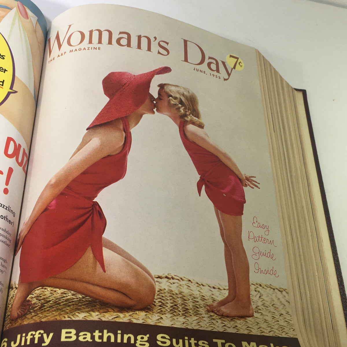 Cover of June 1953 Woman's Day magazine displaying a mother and daughter dressed in matching red bathing suits at the beach.