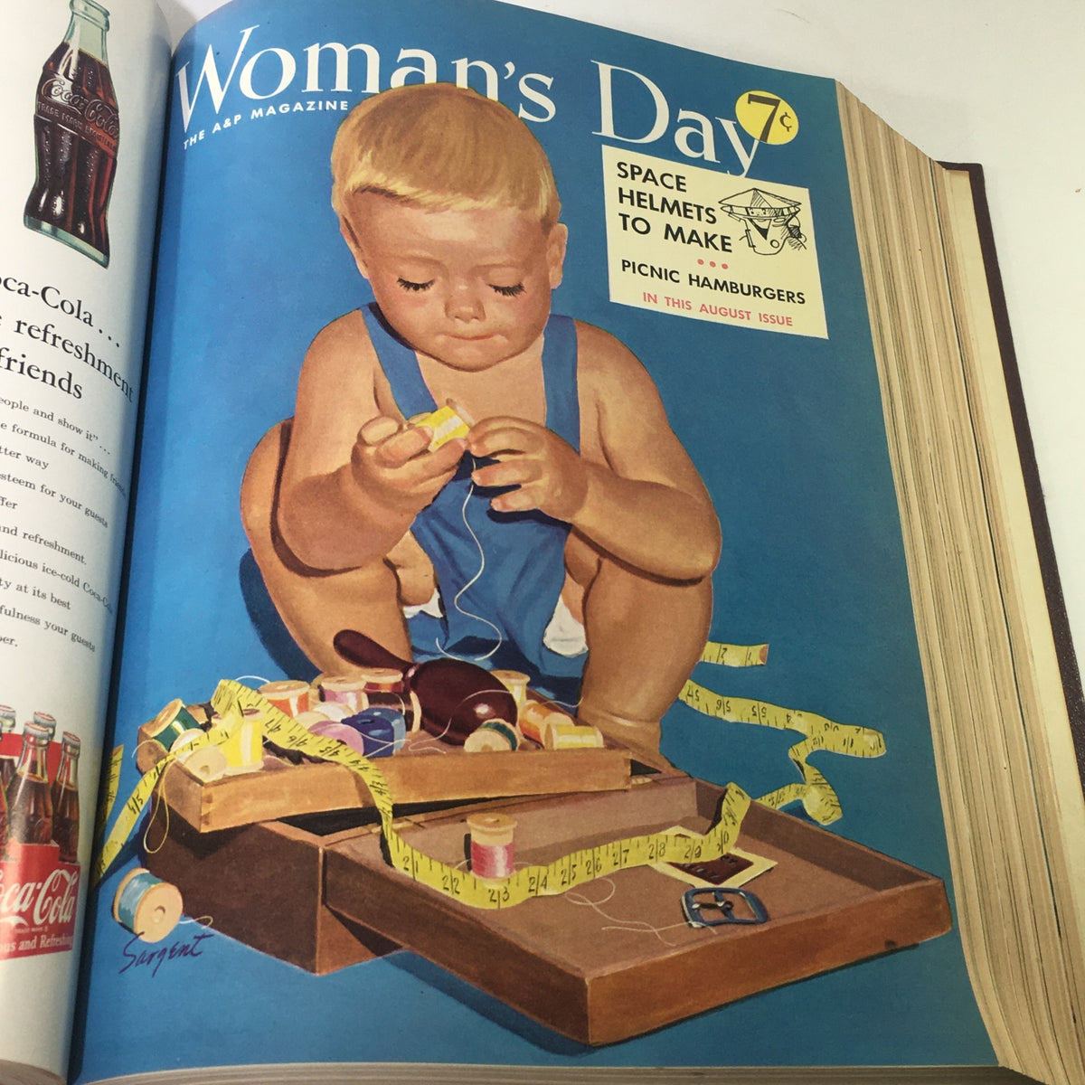 Cover of August 1953 Woman's Day magazine illustrating a toddler playing with spools of thread in a colorful setting.