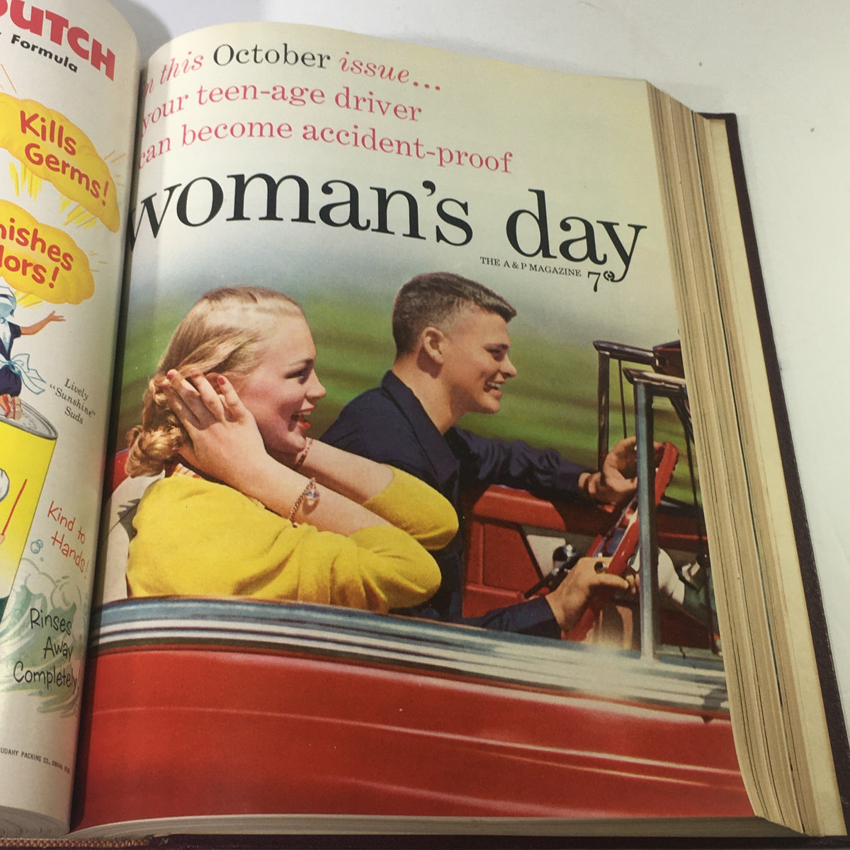 Vintage Woman's Day Magazine from October 1953 featuring a couple in a car, reflecting the fashion and lifestyle of the time.