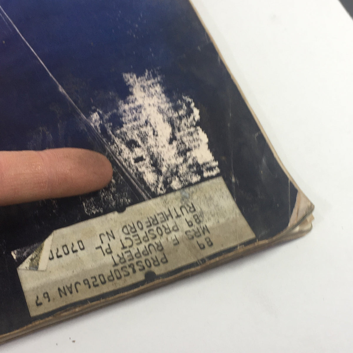 Close-up of the back cover of The Saturday Evening Post, November 19, 1966, displaying vintage magazine's address label and wear details typical for a collectible item.
