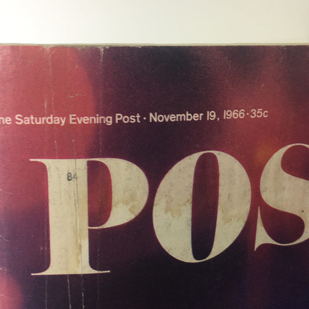 Detail of the top section of The Saturday Evening Post cover dated November 19, 1966, showing the publication's title and date with some age markings.