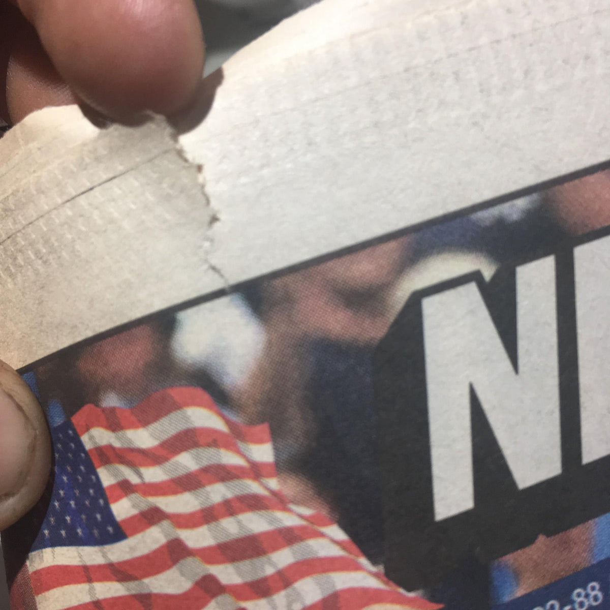 Close-up view of the July 10, 2011, New York Post newspaper showing a tear on the edge, reporting on Derek Jeter making history with a home run.