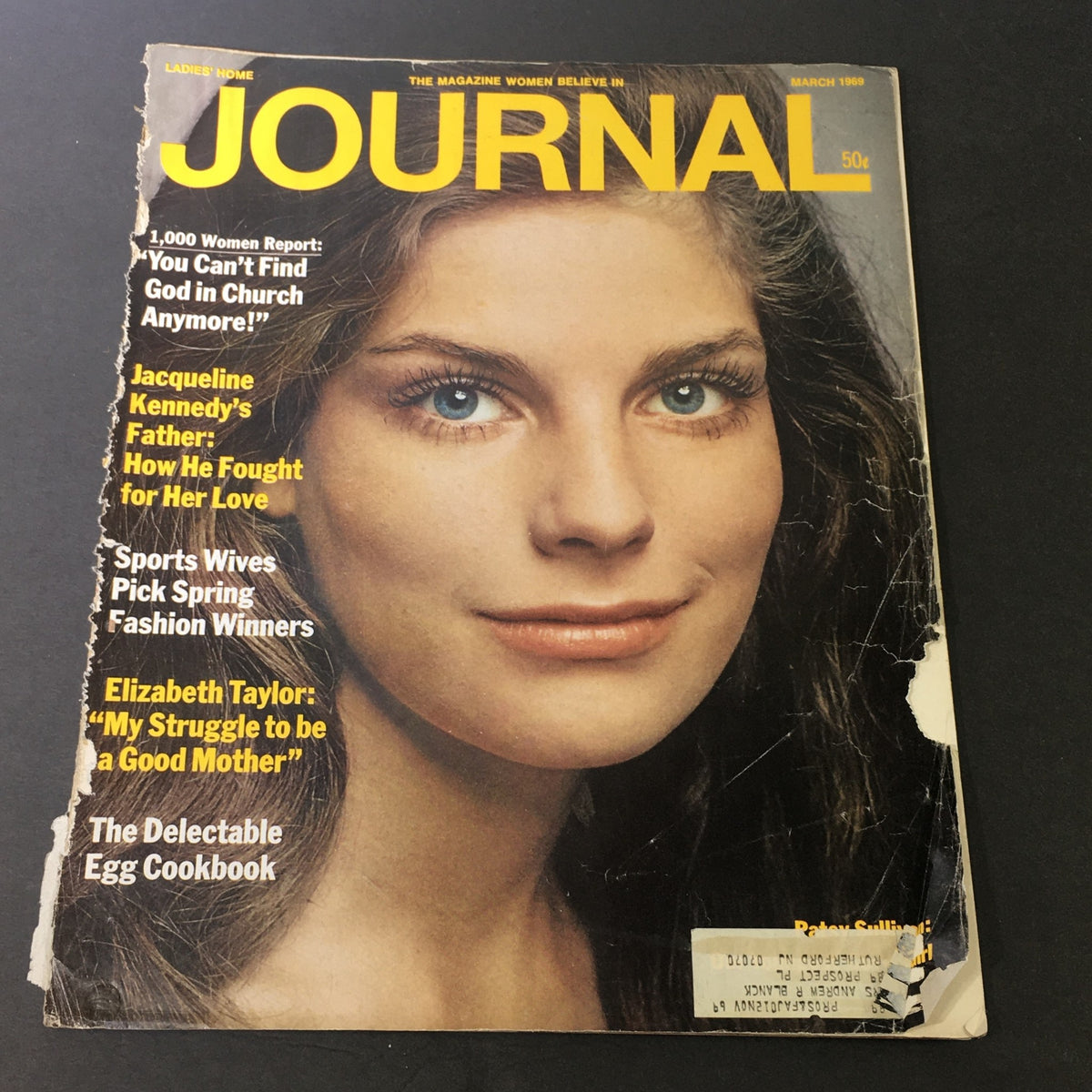 Cover of the VTG Journal Magazine March 1969 featuring a model's portrait and bold text highlighting articles on Jacqueline Kennedy and Elizabeth Taylor.