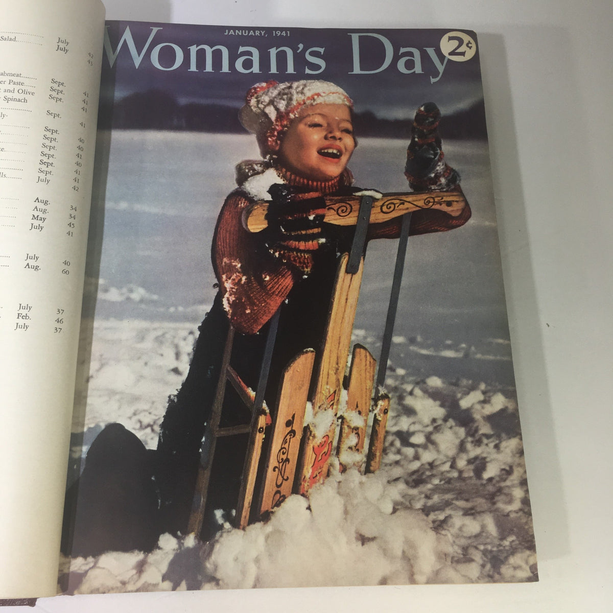 1941 Woman's Day Magazine Compilation showcasing the January cover featuring a joyful child in winter clothing playing with a sled.