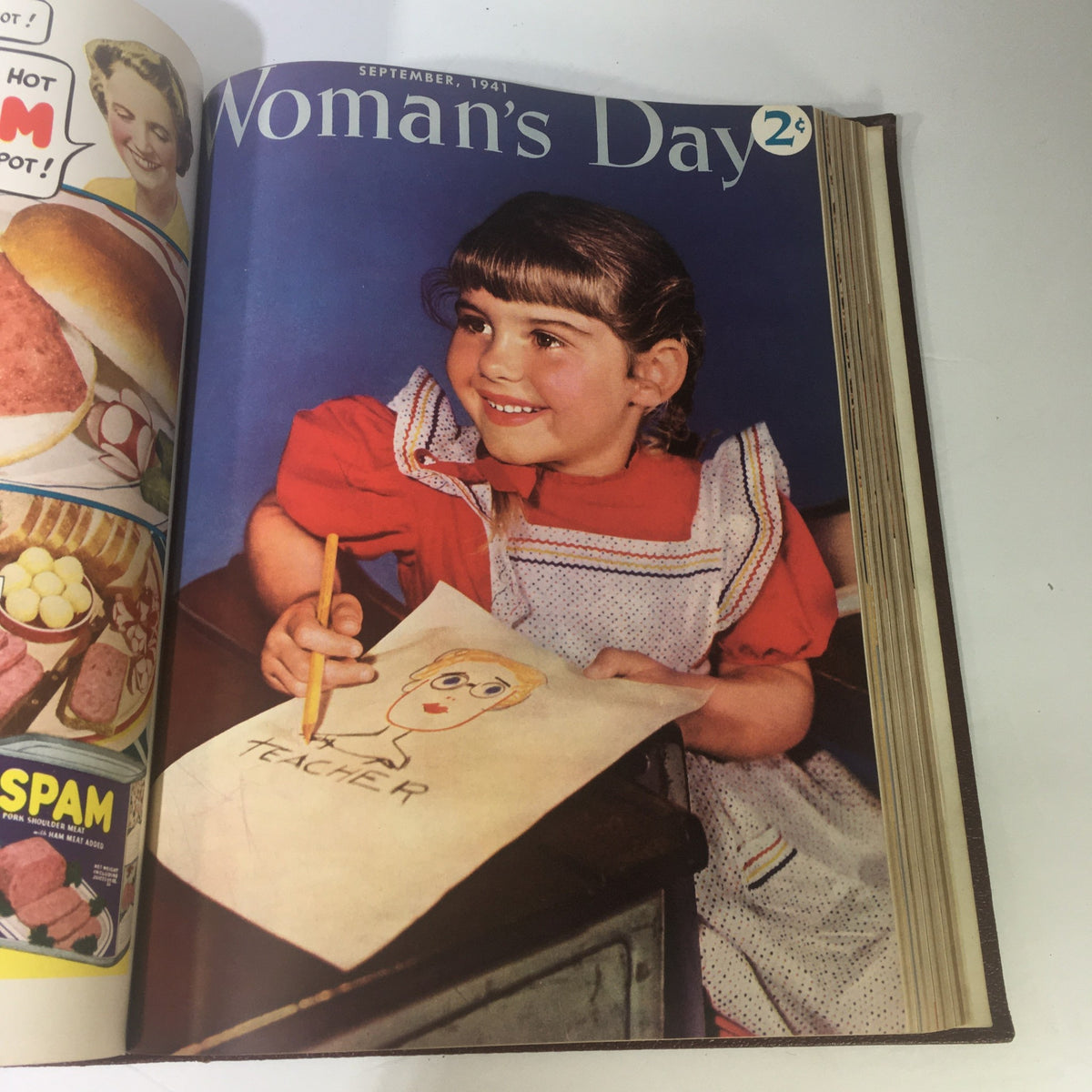 1941 Woman's Day Magazine Compilation showcasing a cheerful young girl drawing, reflecting childhood creativity and education in September 1941.