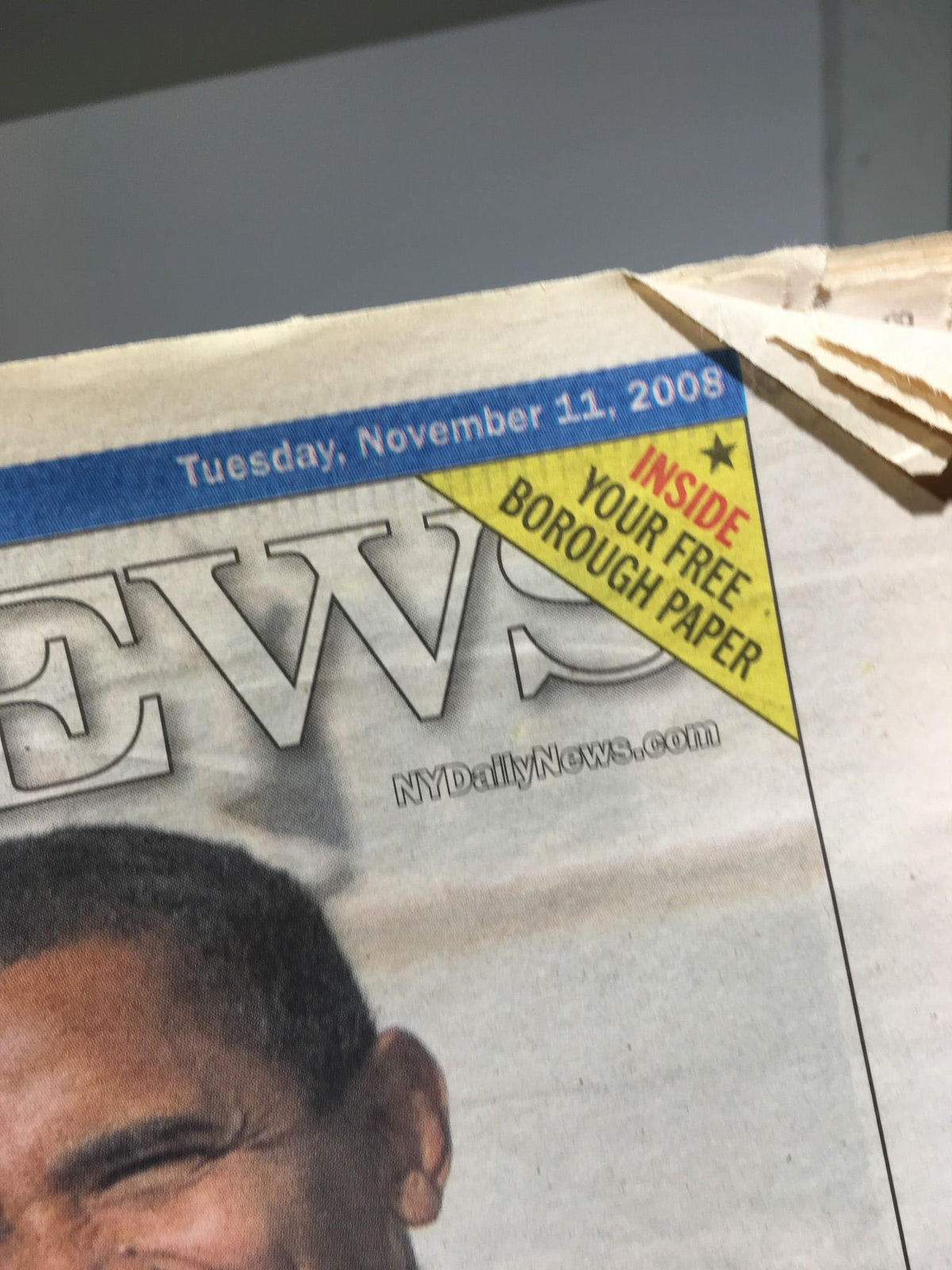 Close-up of the New York Daily News logo with date 'Tuesday, November 11, 2008', featuring the special coverage of the Obamas' welcome.