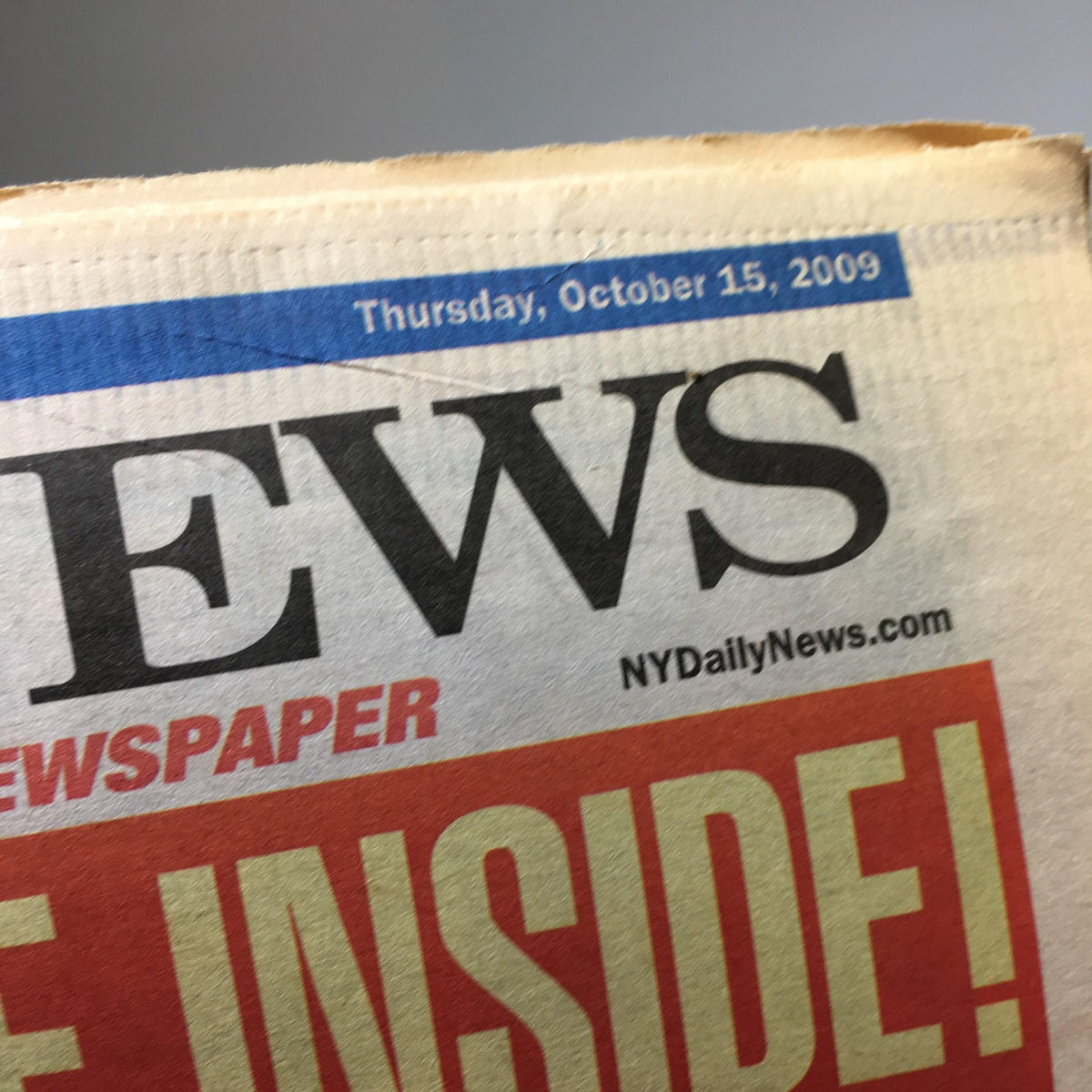 Close-up of the New York Daily News masthead from October 15, 2009, showing the date and newspaper title, emphasizing its historical significance.