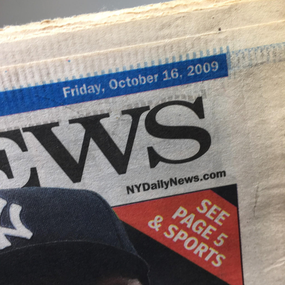 Close-up of the New York Daily News date header from October 16, 2009, displaying the publication's logo and the date for the 'HEAT OF THE NIGHT' issue.