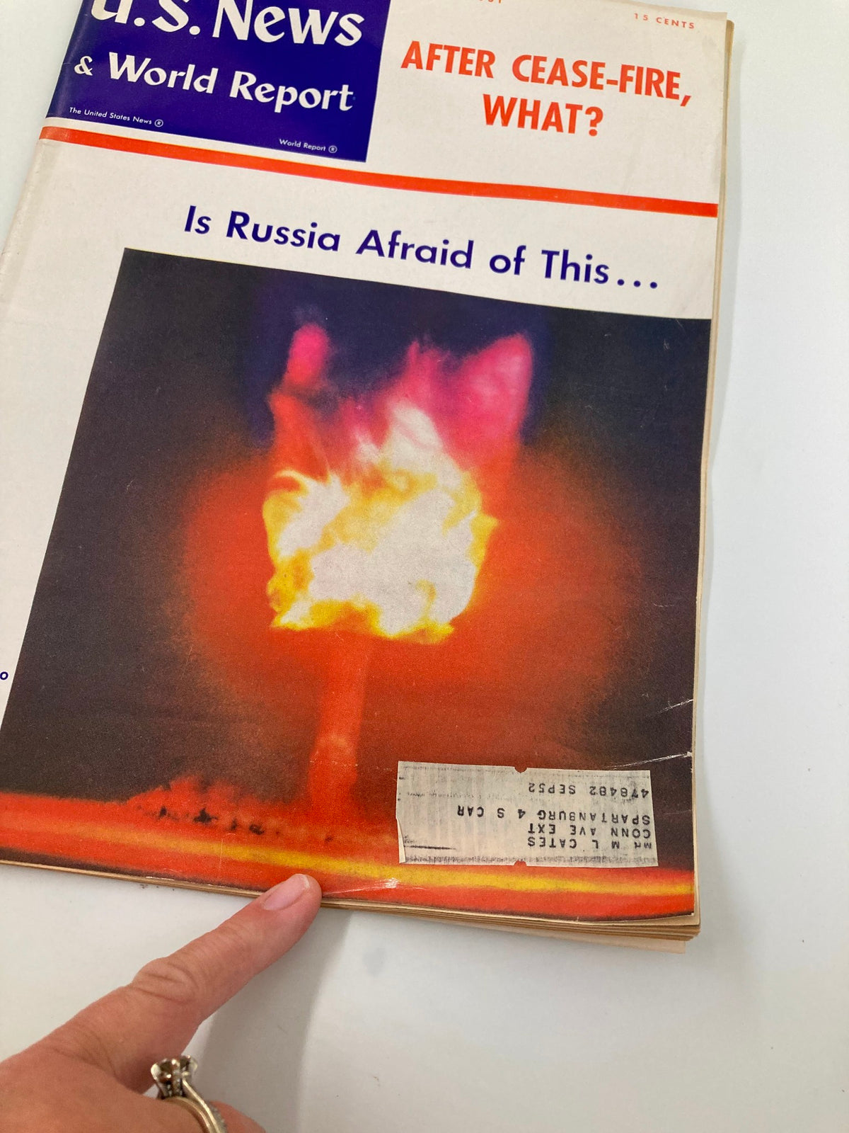 Close-up of the cover of US News & World Report Magazine July 6 1951, highlighting the striking color photo of an atomic blast and details of the magazine's publication.