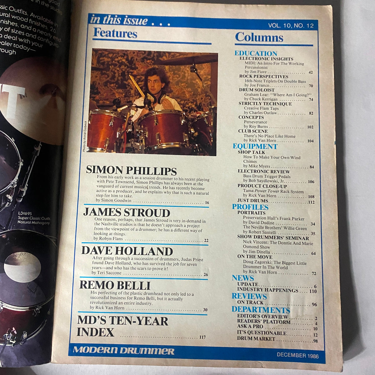 Inside page of VTG Modern Drummer Magazine December 1986 Vol 10 No. 12, listing features including Simon Phillips and industry insights. Perfect for drumming enthusiasts.