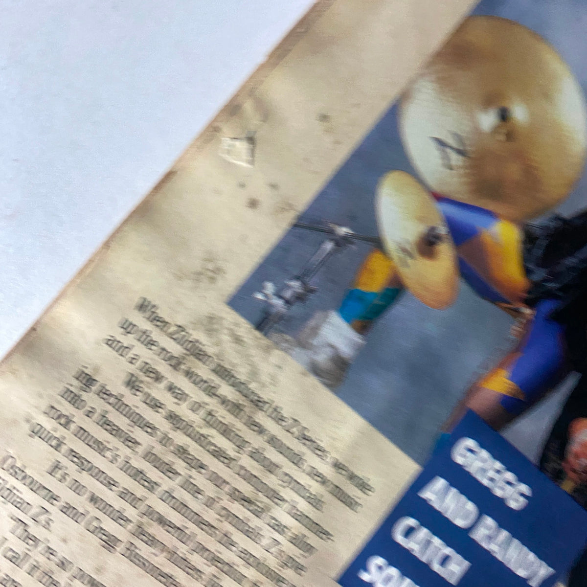 Vintage Modern Drummer Magazine May 1987 Issue 90 featuring Vinnie Colaiuta, showcasing a close-up view of the magazine's page with drumming content and images.