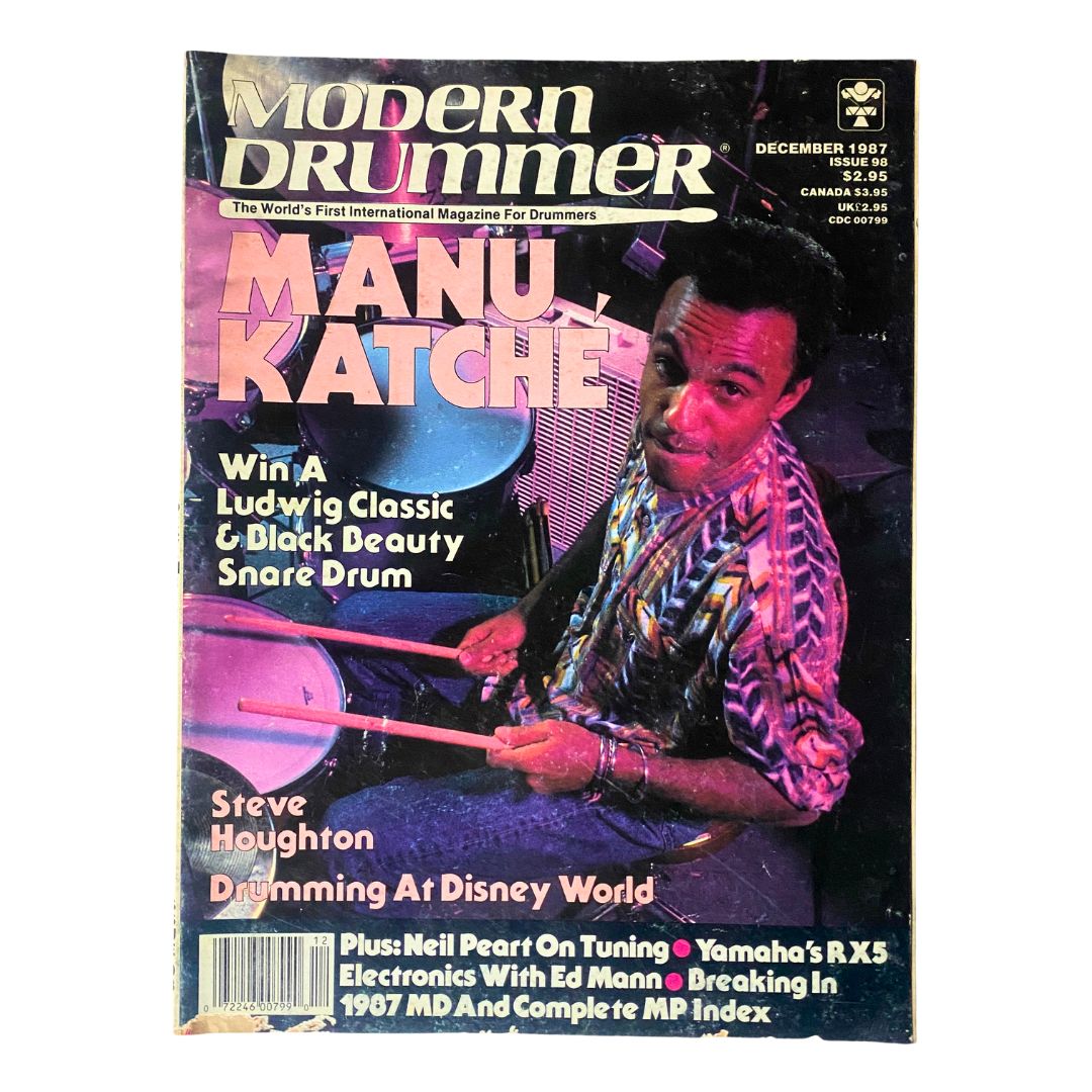 VTG Modern Drummer Magazine December 1987 featuring renowned drummer Manu Katche on the cover, showcasing images and articles about the drumming scene in the late 80s.