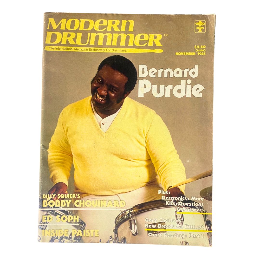 Cover of 'VTG Modern Drummer Magazine November 1985 Vol 9 No. 11' featuring Bernard Purdie, showcasing his vibrant smile and drumming legacy.