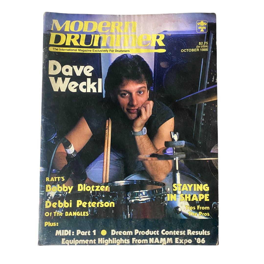 Modern Drummer Magazine from October 1986 featuring Dave Weckl on the cover, showcasing his drumming talent with a striking pose.