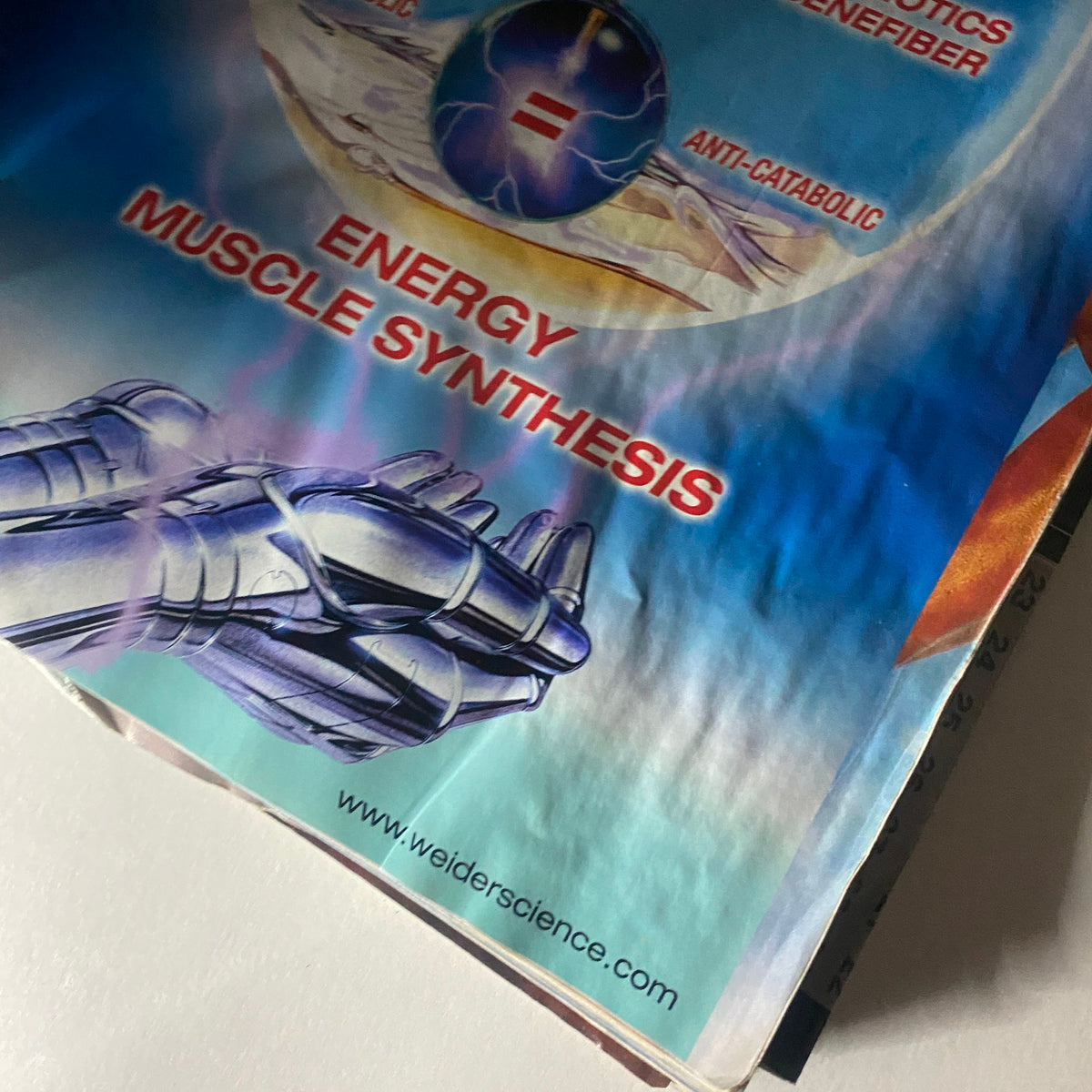 Close-up of a page from Muscle & Fitness Magazine April 2000 discussing energy muscle synthesis and showcasing scientific insights related to fitness.