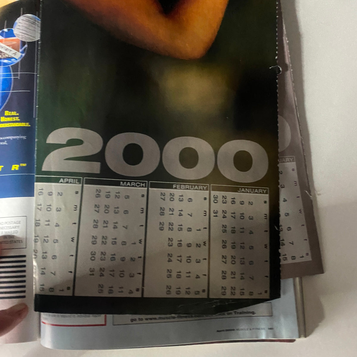 A calendar page for the year 2000 included in Muscle & Fitness Magazine April 2000, marking significant dates for fitness events.