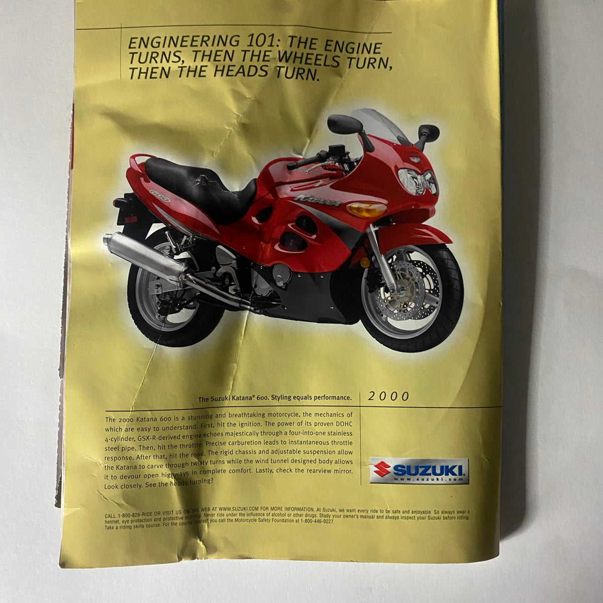 Advertisement for Suzuki motorcycle featured in Muscle & Fitness Magazine April 2000, highlighting performance and engineering.