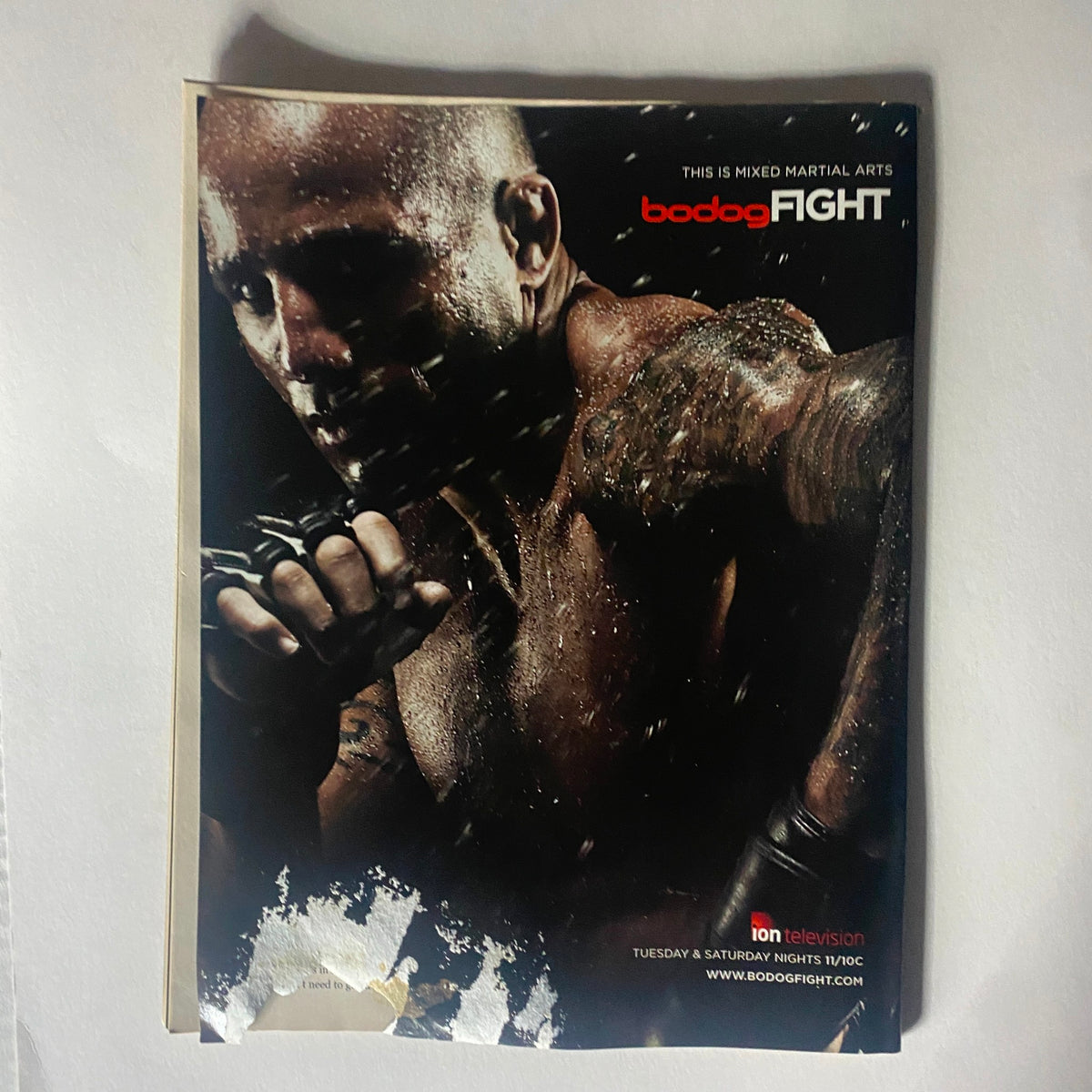 Interior page of Real Fighter Magazine 2007 Issue 13 highlighting Bodog Fight, featuring a fighter in action, emphasizing the intensity of mixed martial arts.