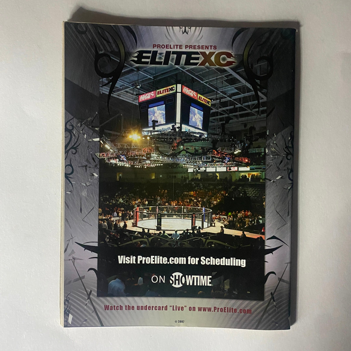 Back cover of Real Fighter Magazine 2007 Issue 12, highlighting the EliteXC event with a packed arena showcasing mixed martial arts action.