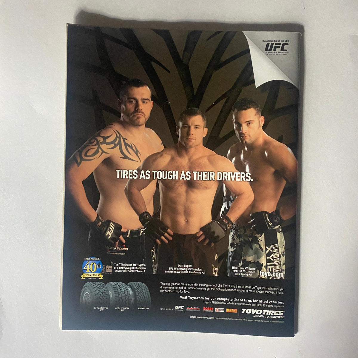 Back cover of Real Fighter Magazine 2006 Issue 9 displaying an advertisement with three MMA fighters, emphasizing the tagline 'Tires as Tough as Their Drivers.'
