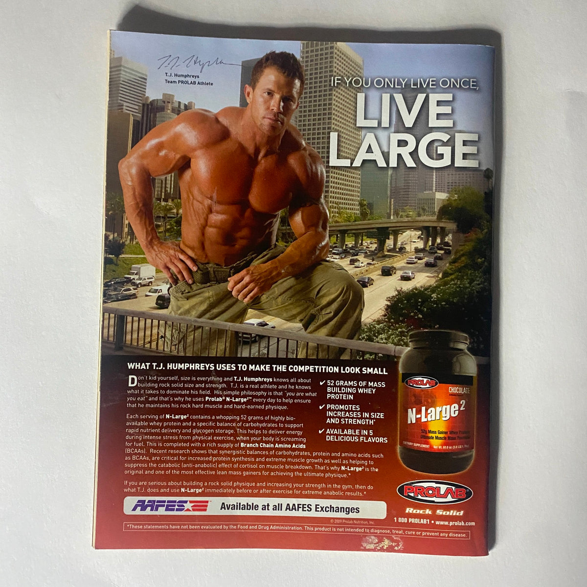 Back cover of Real Fighter Magazine 2009 Issue 24, showcasing an advertisement for a health supplement, featuring a muscular model under the slogan 'LIVE LARGE'.