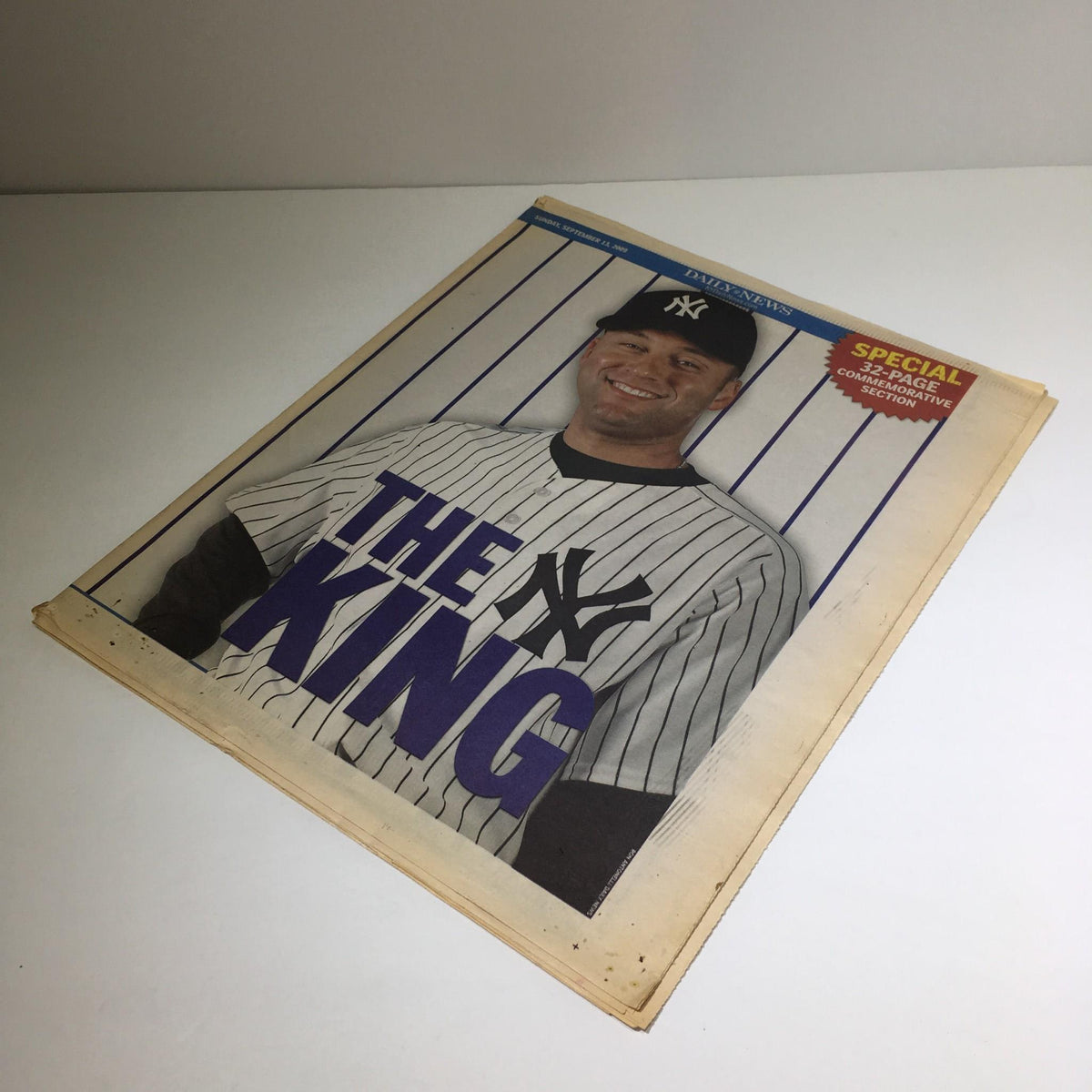 Cover of the NY Daily News magazine from September 12, 2009, featuring the title 'The King' highlighting Derek Jeter, showcasing his iconic New York Yankees jersey and significance in baseball history.