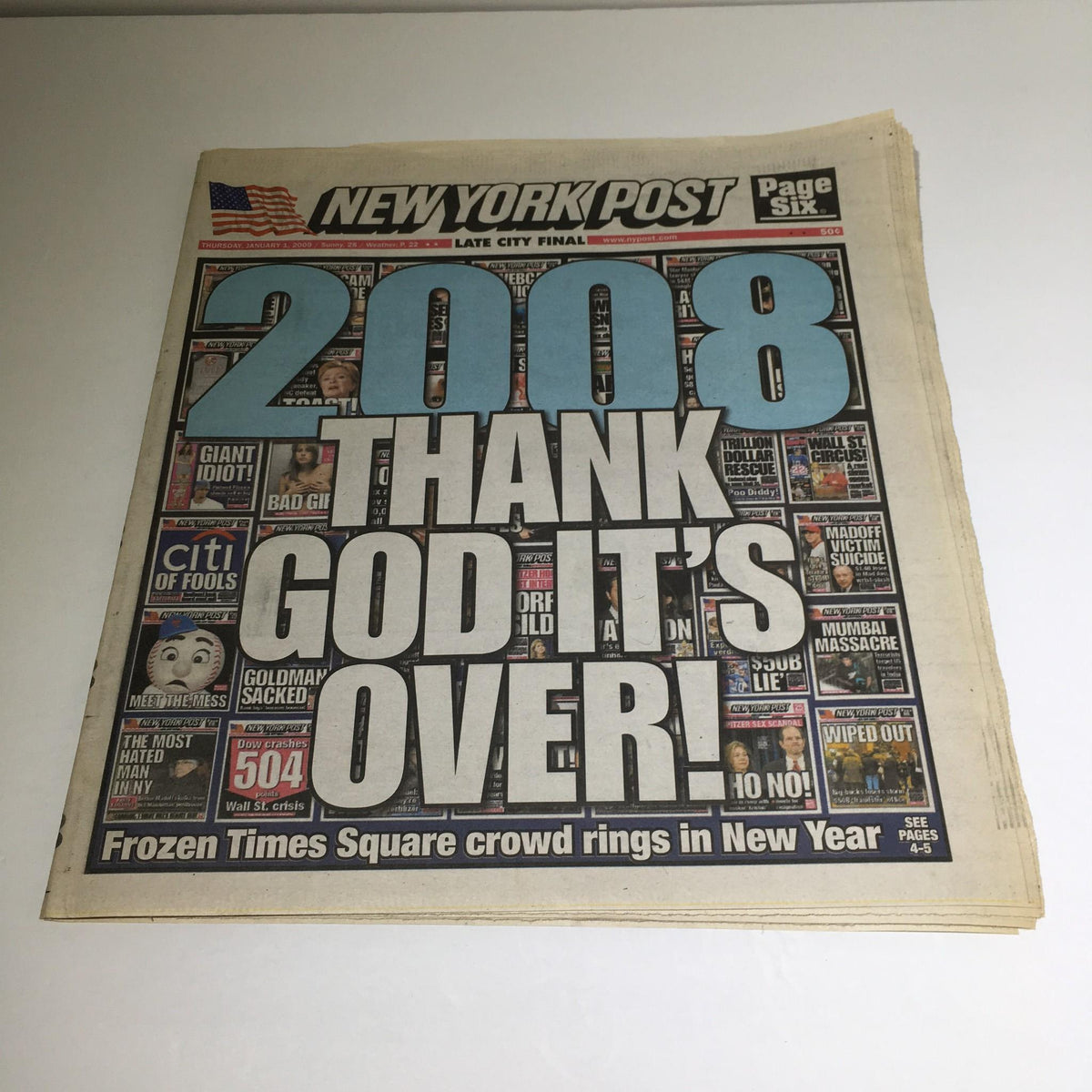 New York Post headline from January 1, 2009, featuring the prominent text '2008 THANK GOD IT'S OVER!' with a layout celebrating New Year's Day and mentioning Frozen Times Square.