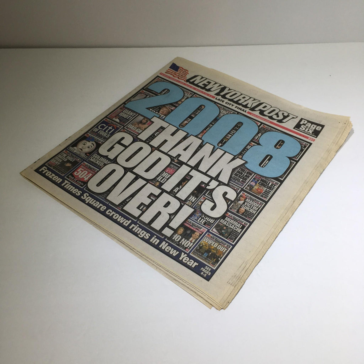 New York Post newspaper dated January 1, 2009, featuring the headline '2008 Thank God It's Over,' showcasing the New Year's celebration and reflecting on the past year.