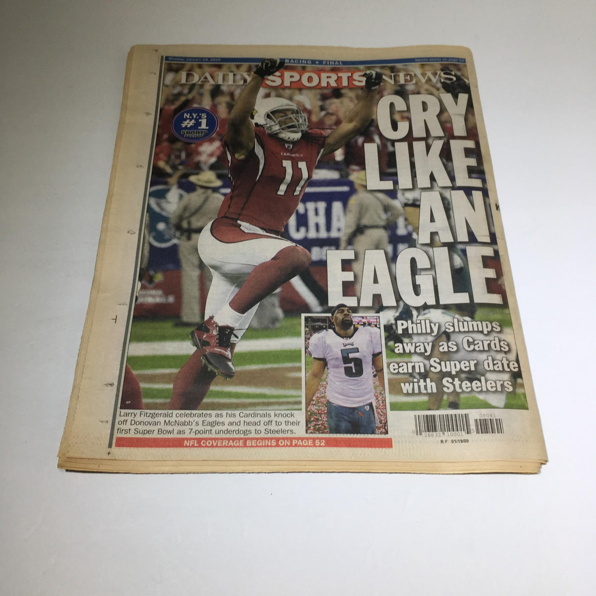 Daily Sports News cover featuring a headline 'CRY LIKE AN EAGLE' alongside an image of Larry Fitzgerald celebrating during a football game.