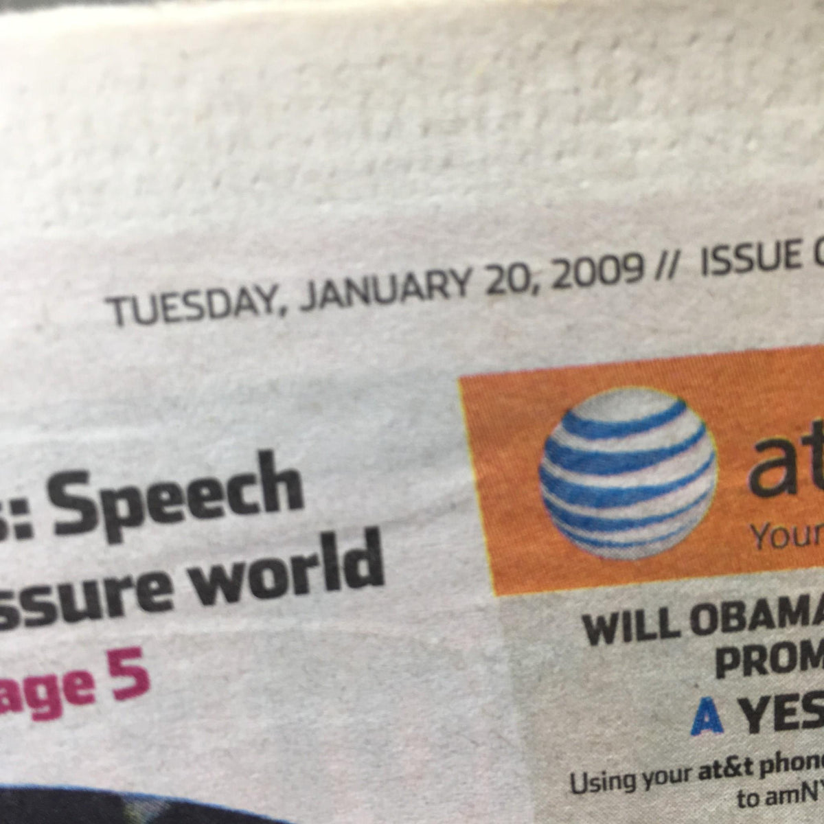 AM New York newspaper dated January 20, 2009, featuring the headline about global pressures and a discussion on President Obama's impact.
