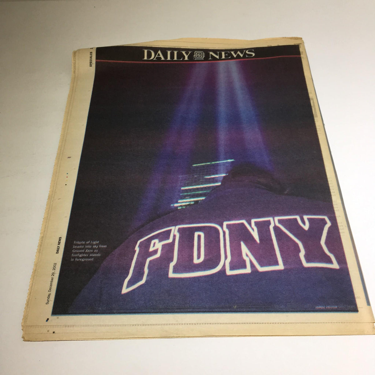 Back cover of New York Daily News: December 29, 2002, The Year in Pictures highlighting an FDNY-themed image.