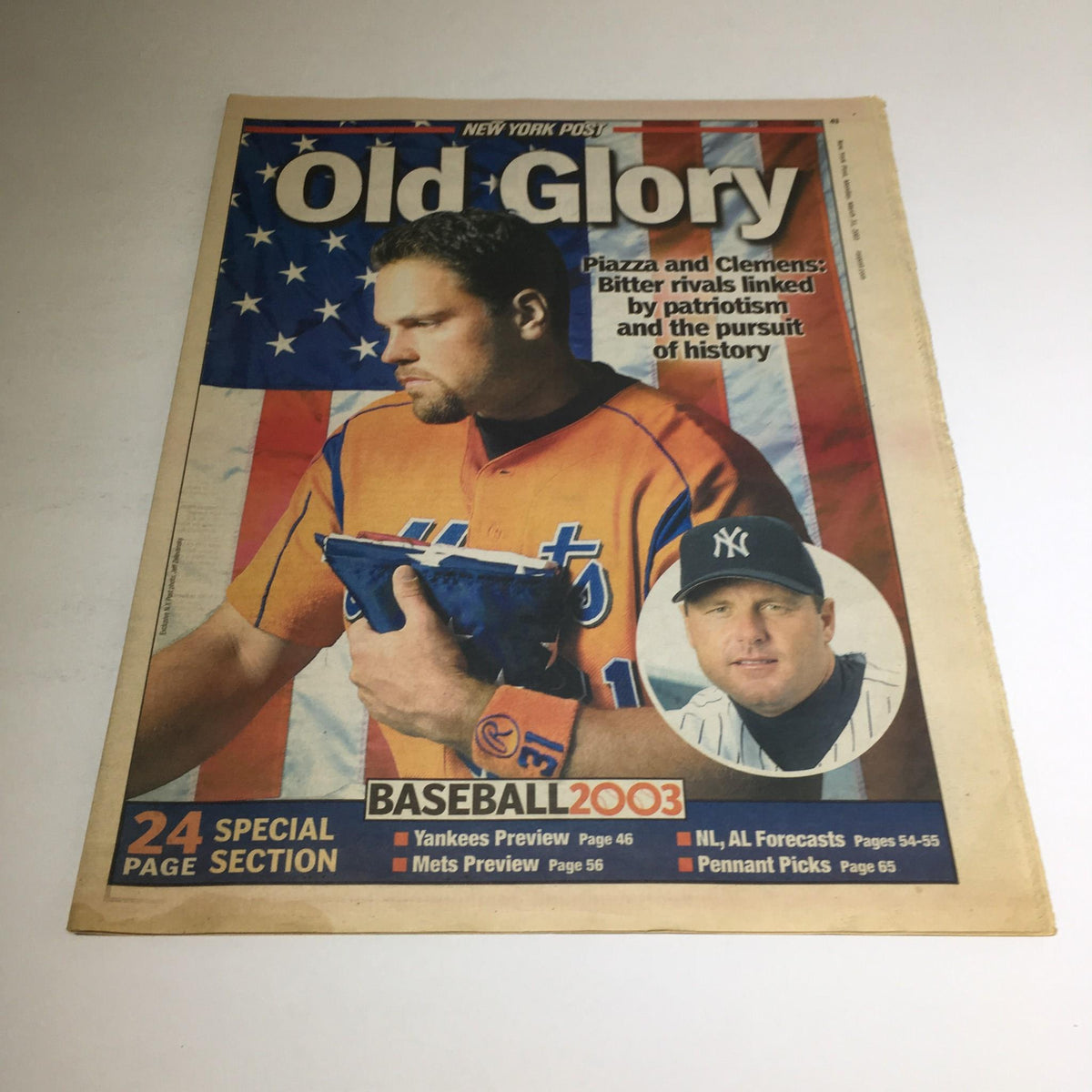 New York Post: March 31 2003 cover showcasing Old Glory, featuring baseball highlights and images of rivals Piazza and Clemens with an American flag backdrop.