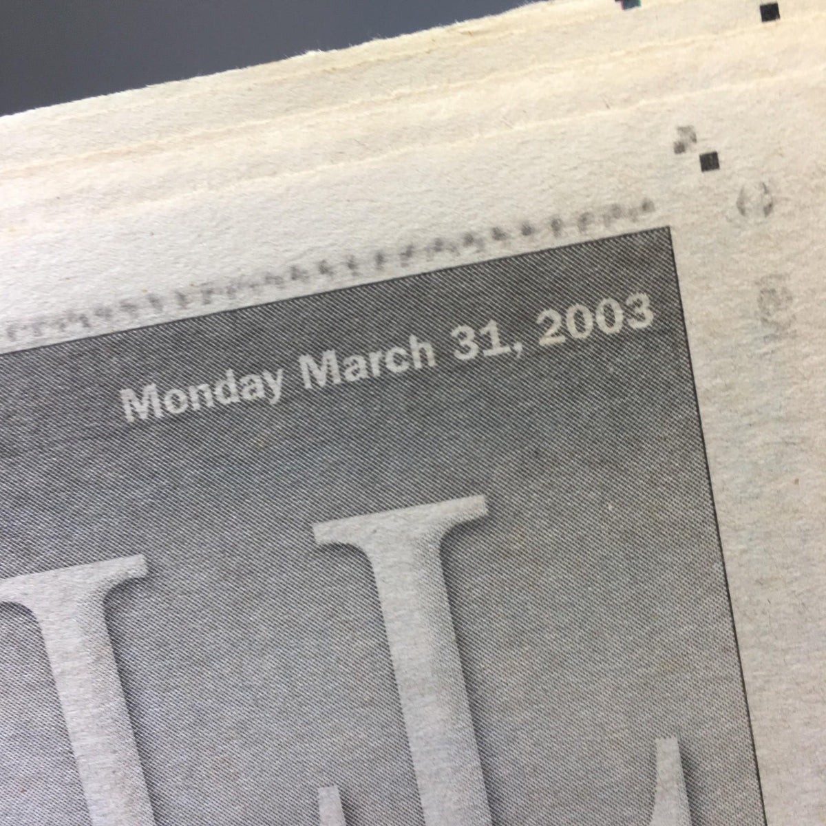 Close-up of the New York Daily News date header showing 'Monday March 31, 2003' on the newspaper titled 'Feud For Thought'.