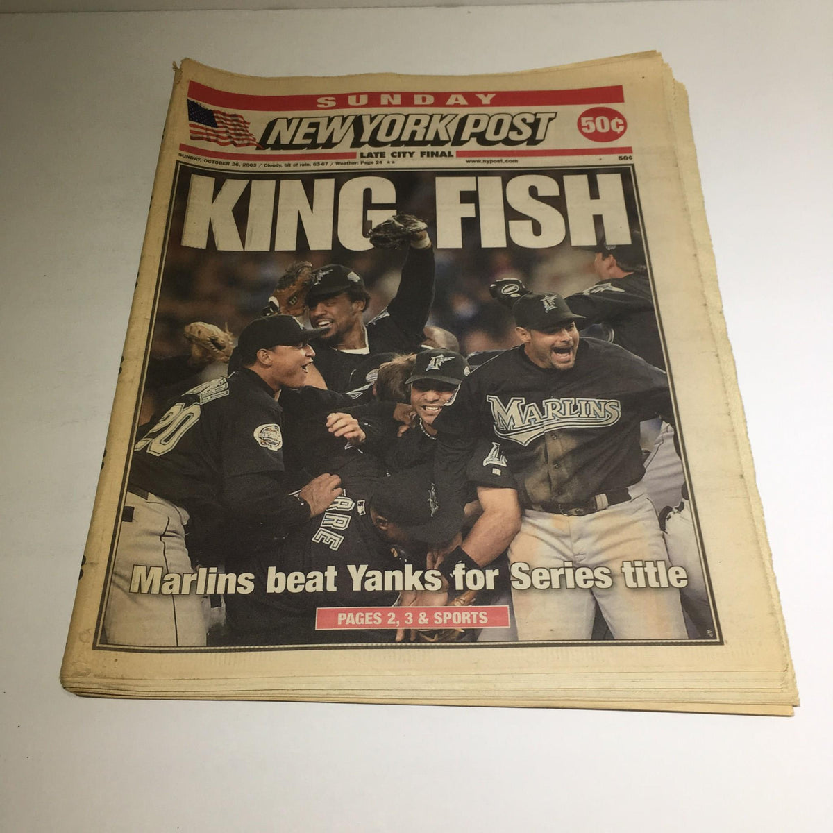 Front page of the New York Post dated October 26, 2003, featuring the title 'King Fish' with a celebration scene of the Marlins beating the Yankees for the Series title.
