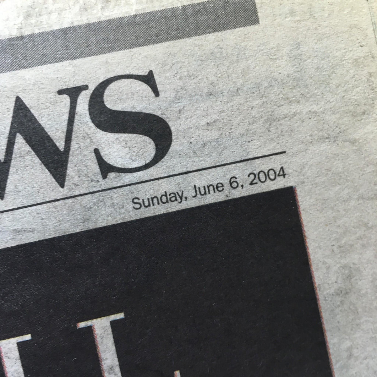 Close-up of the New York Daily News date section showing Sunday, June 6, 2004, from the edition commemorating Ronald Reagan's legacy.