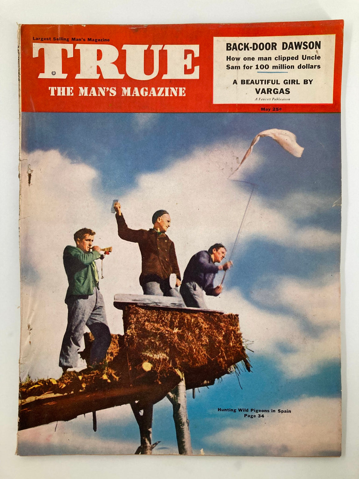 TRUE The Man's Magazine May 1952 cover featuring men hunting wild pigeons in Spain, showcasing a vivid outdoor scene.