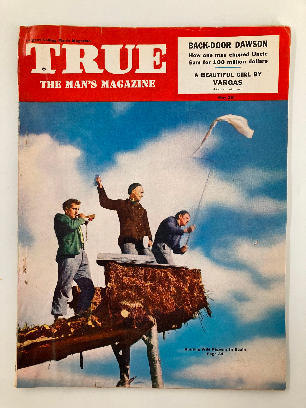 Cover of TRUE The Man's Magazine from May 1952 featuring a vibrant illustration of men hunting wild pigeons, with the iconic artwork 'A Beautiful Girl by Vargas' prominently displayed.