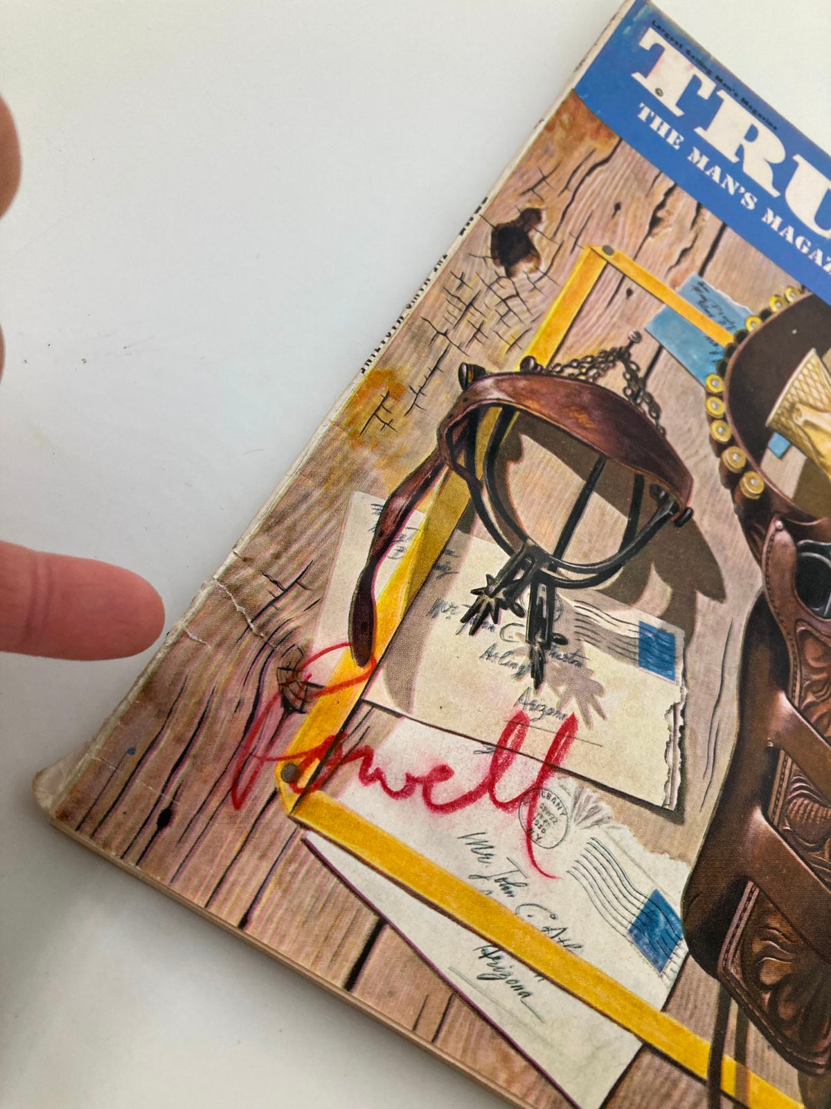 Close-up detail of the cover of TRUE The Man's Magazine September 1951, highlighting the vintage gun holster and handwritten notes.
