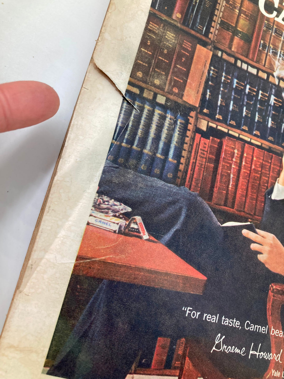Close-up of the edge of TRUE The Man's Magazine, August 1960, highlighting wear and tear associated with its age. This collectible magazine represents a piece of history for vintage magazine aficionados.
