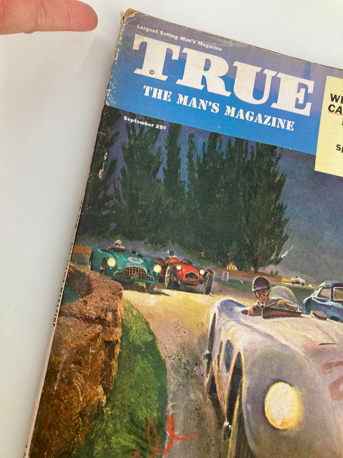 Close-up of TRUE The Man's Magazine September 1953 cover, showcasing the racing cars and details of the magazine title.
